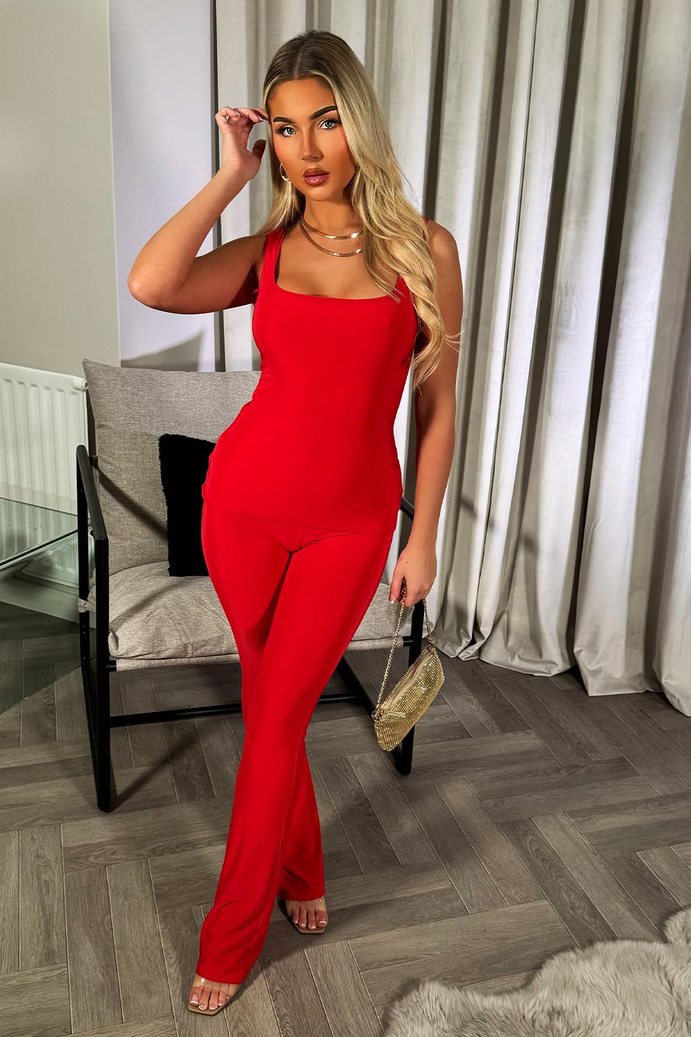 womens red top and flared trousers two piece going out party outfit