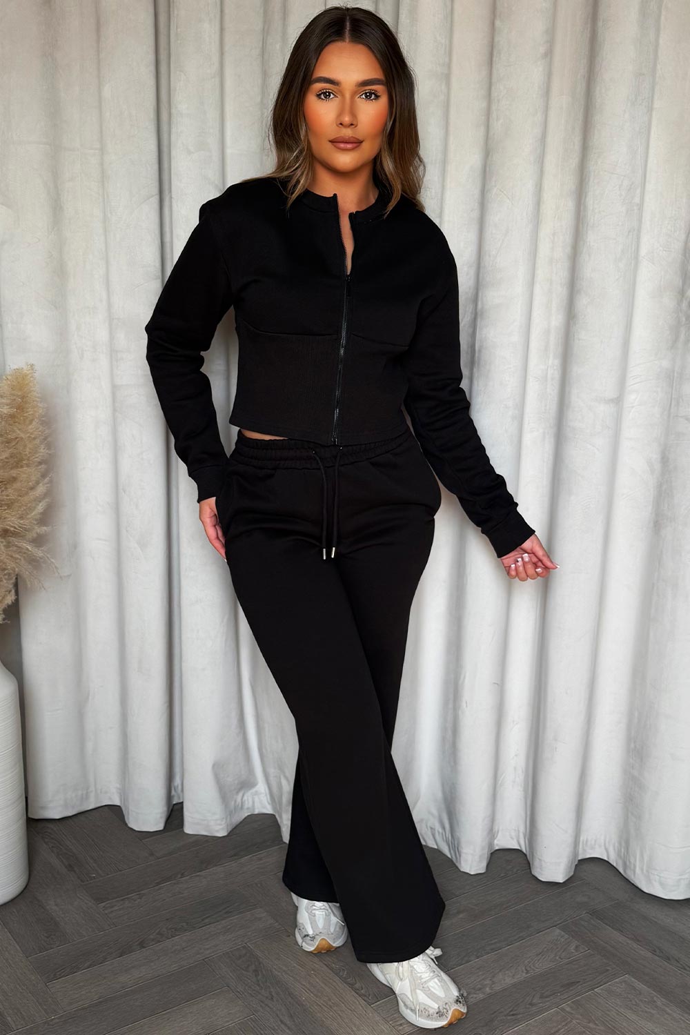 zip up crop sweatshirt corset detail and joggers tracksuit co ord set styledup airport travelling outfit