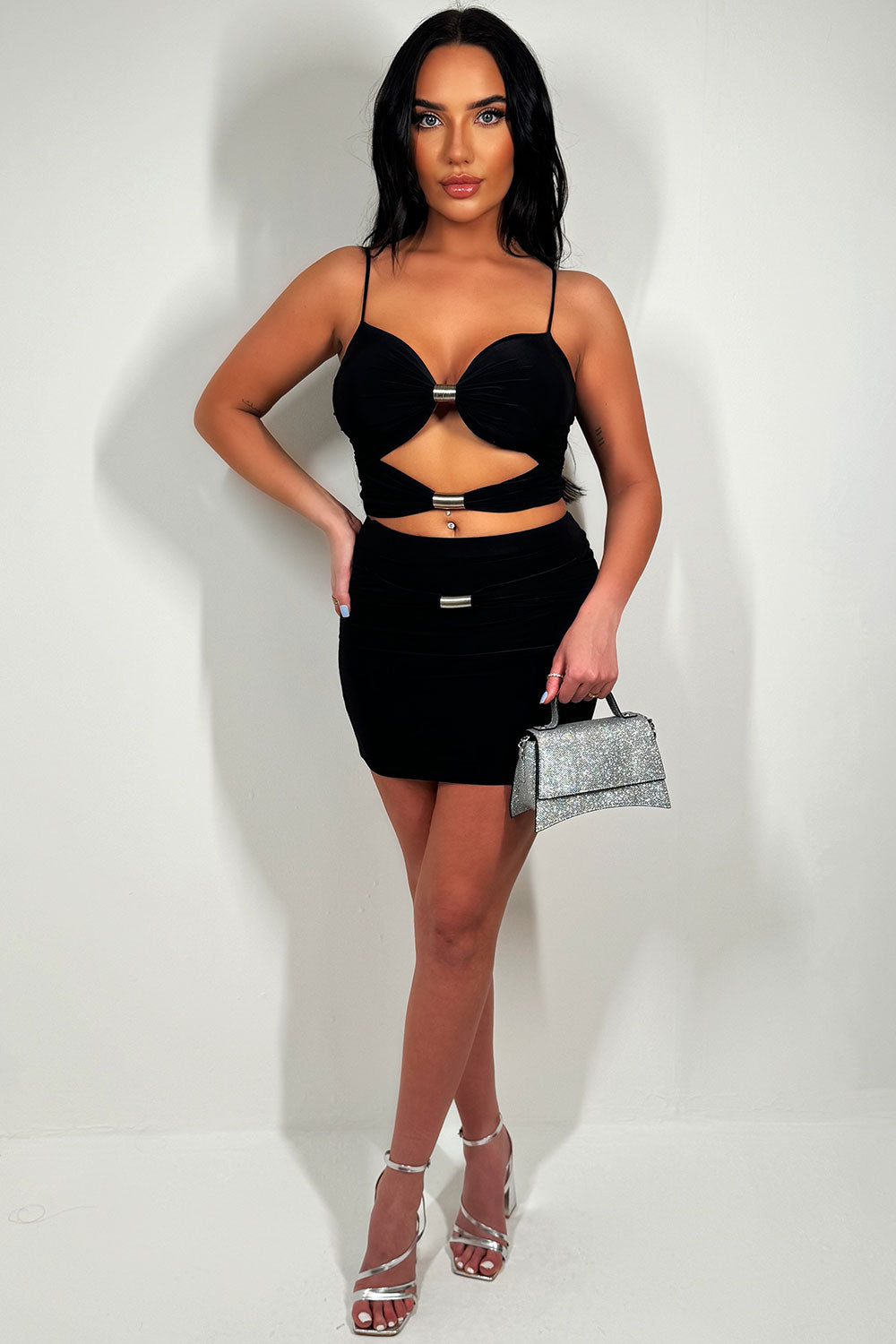 cut out crop top and mini skirt going out two piece set