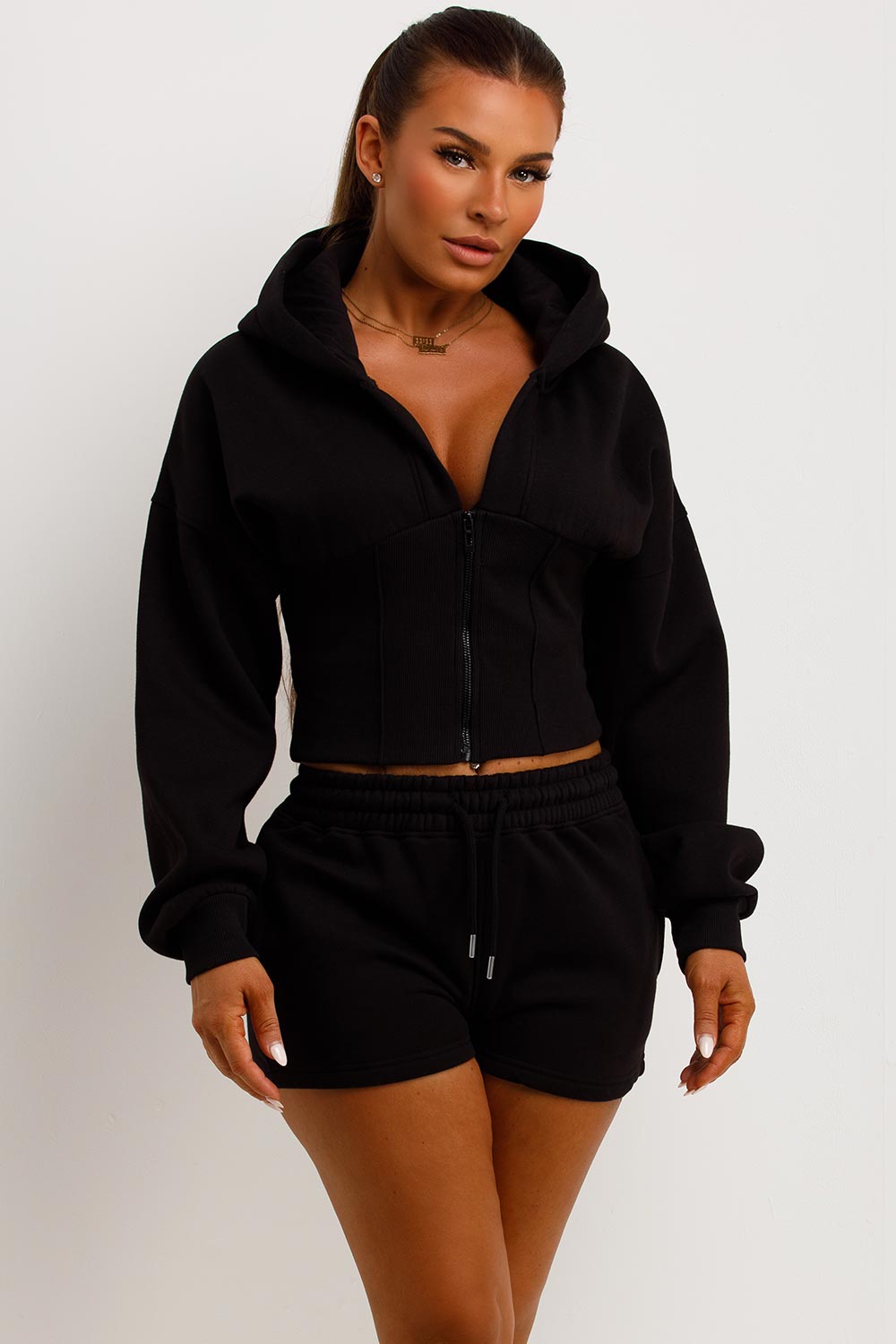 crop hoodie with cinched waist and shorts tracksuit two piece co ord set airport outfit