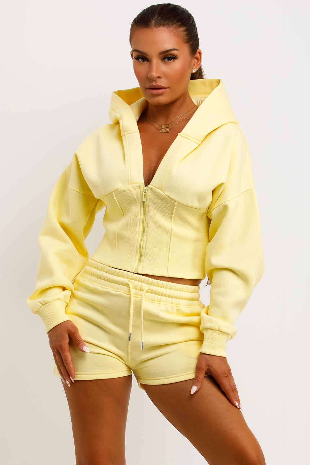 cinched waist crop corset hoodie and shorts tracksuit airport outfit co ord