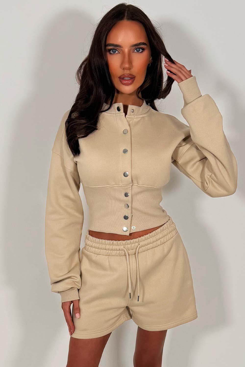 crop button up sweatshirt with cinched waist and shorts tracksuit two piece co ord set airport outfit whitefox uk styledup