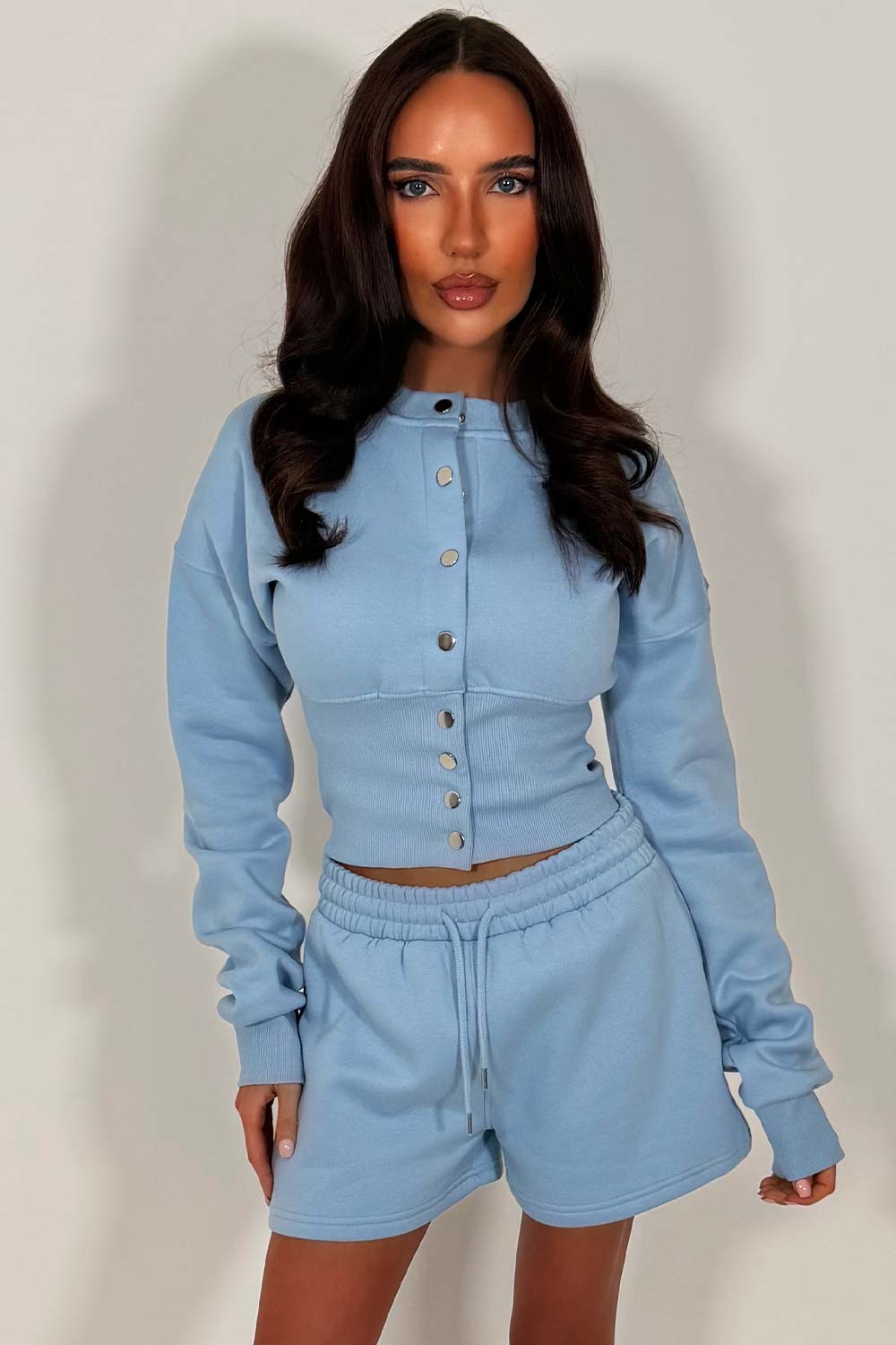 crop button up sweatshirt with cinched waist and shorts tracksuit two piece co ord set airport outfit whitefox uk styledup