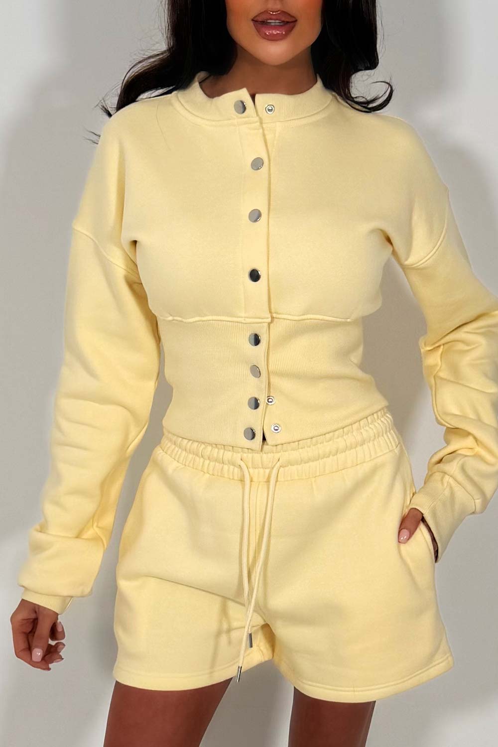crop button up sweatshirt with cinched waist and shorts tracksuit two piece co ord set airport outfit whitefox uk styledup