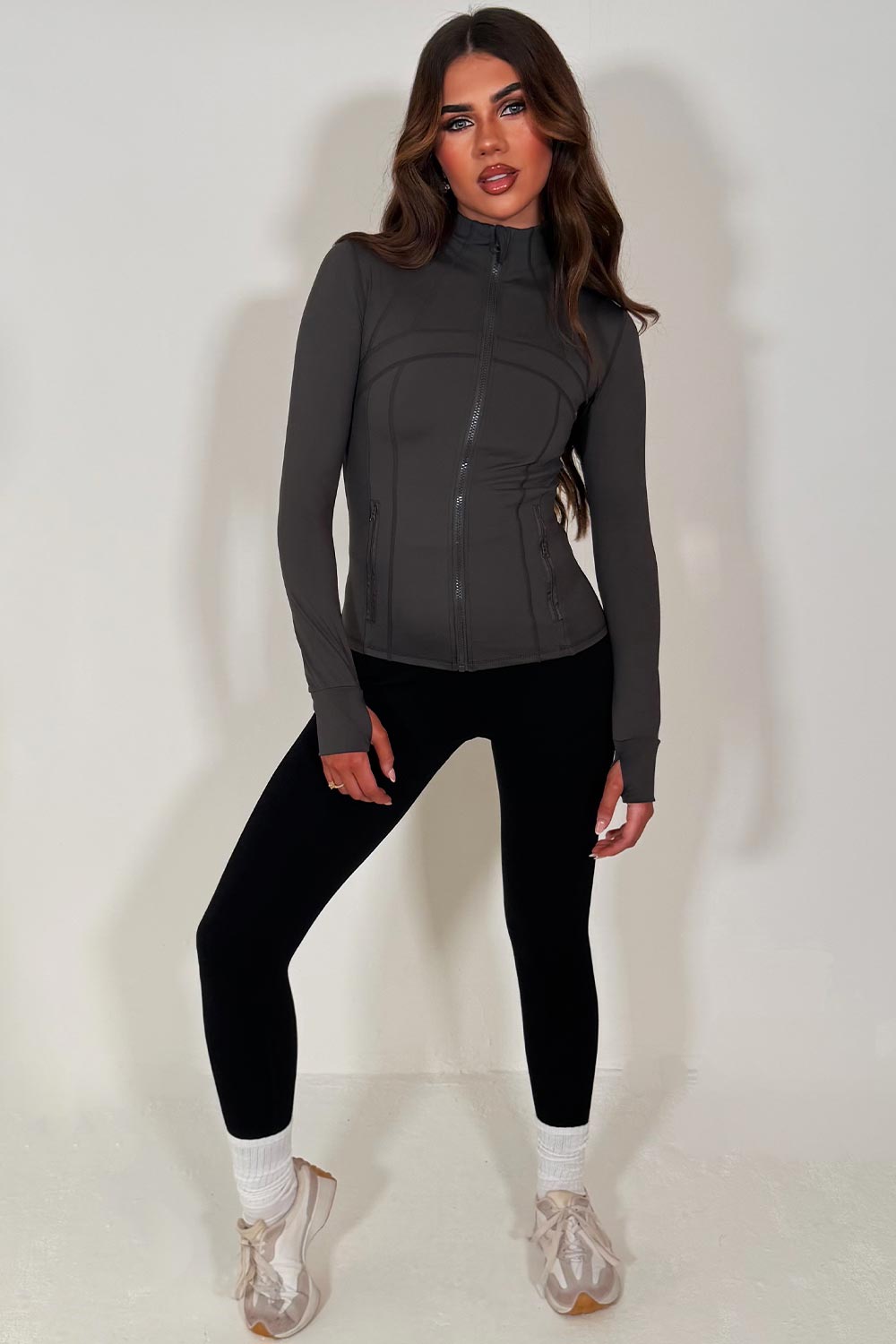 charcoal grey long sleeve sports yoga jacket skis body contouring lululemon