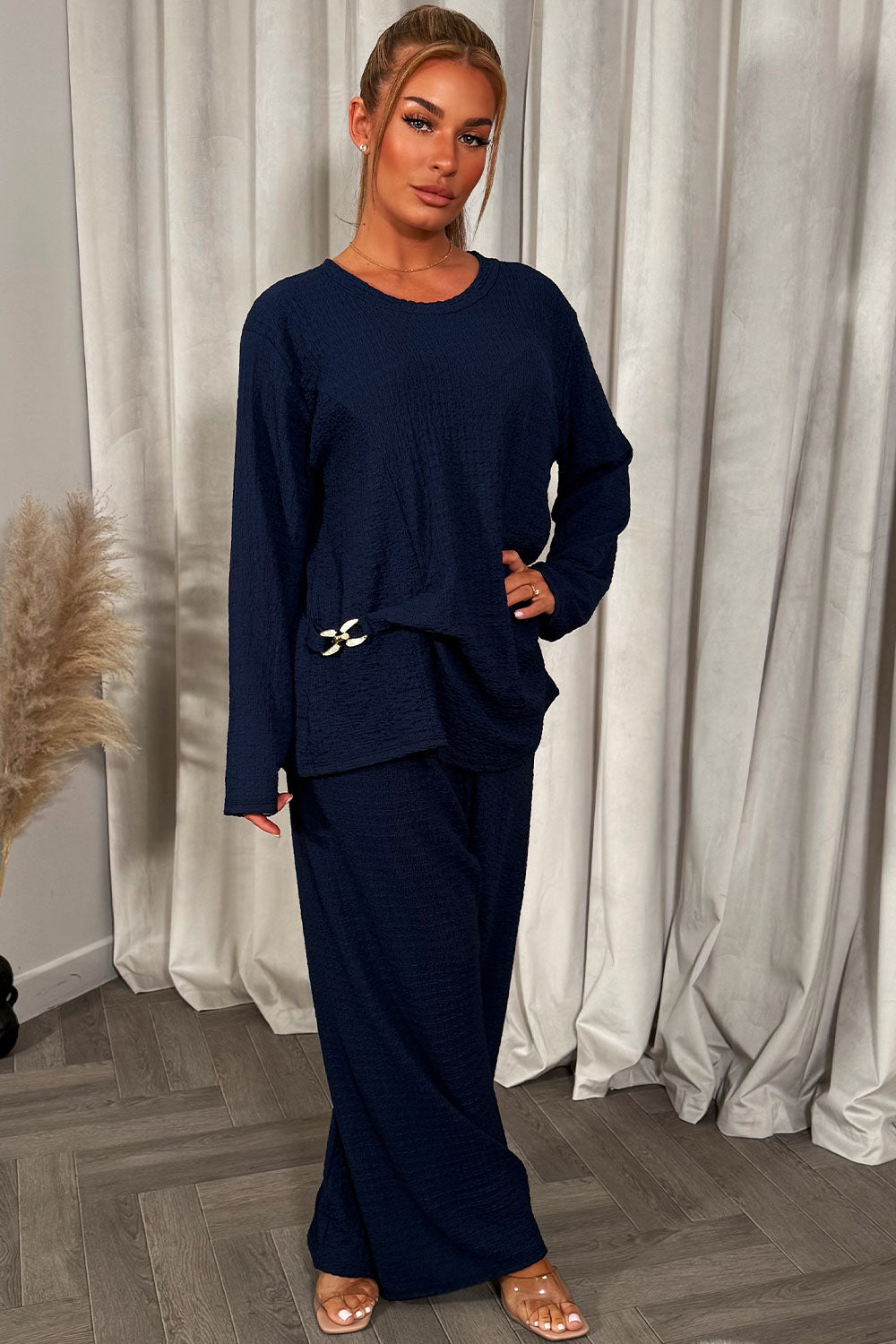 womens navy long sleeve top and trousers co ord set with gold buckle
