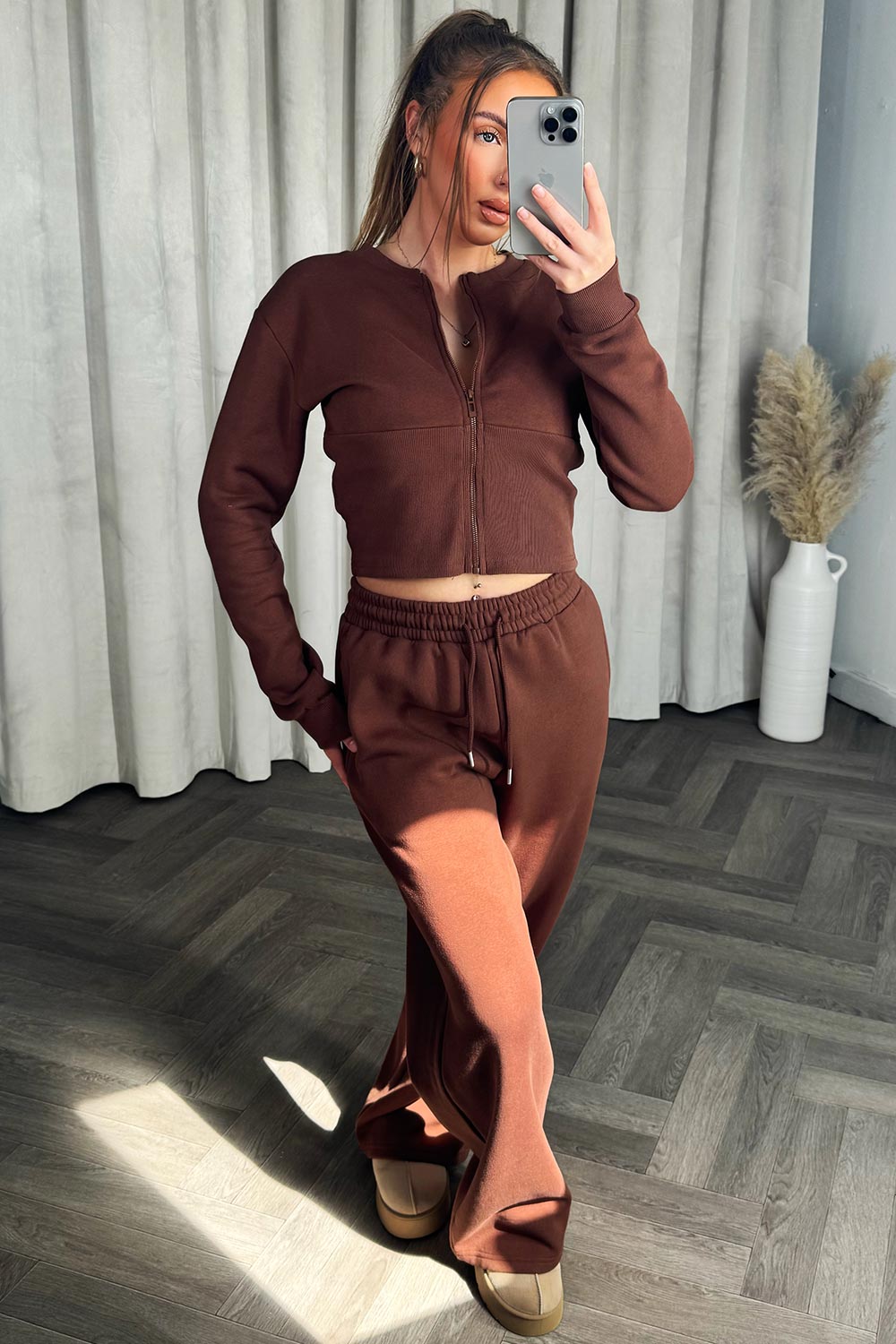 brown zip up corset crop sweatshirt and joggers tracksuit travelling airport outfit styledup