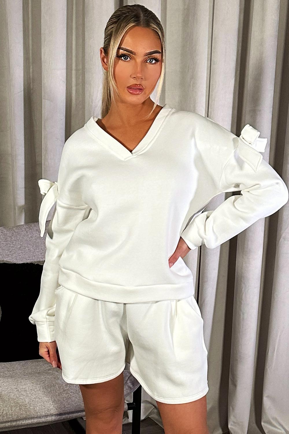 womens sweatshirt with cut out shoulder bow detail and shorts two piece loungewear set