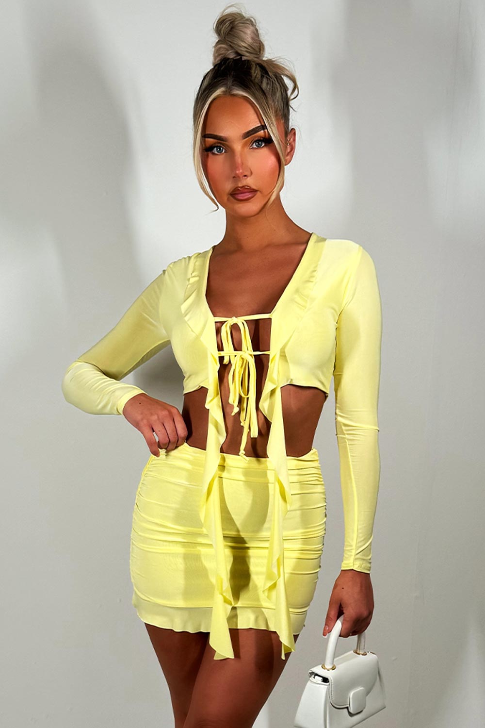 yellow mini skirt and long sleeve tie front frilly crop top set festival going out holiday outfit