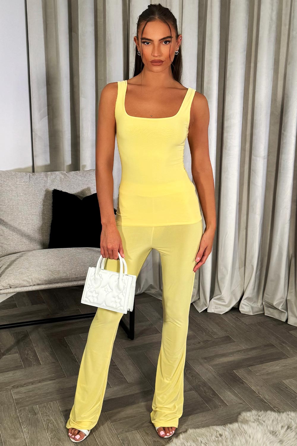 womens yellow top and flared trousers two piece going out party outfit