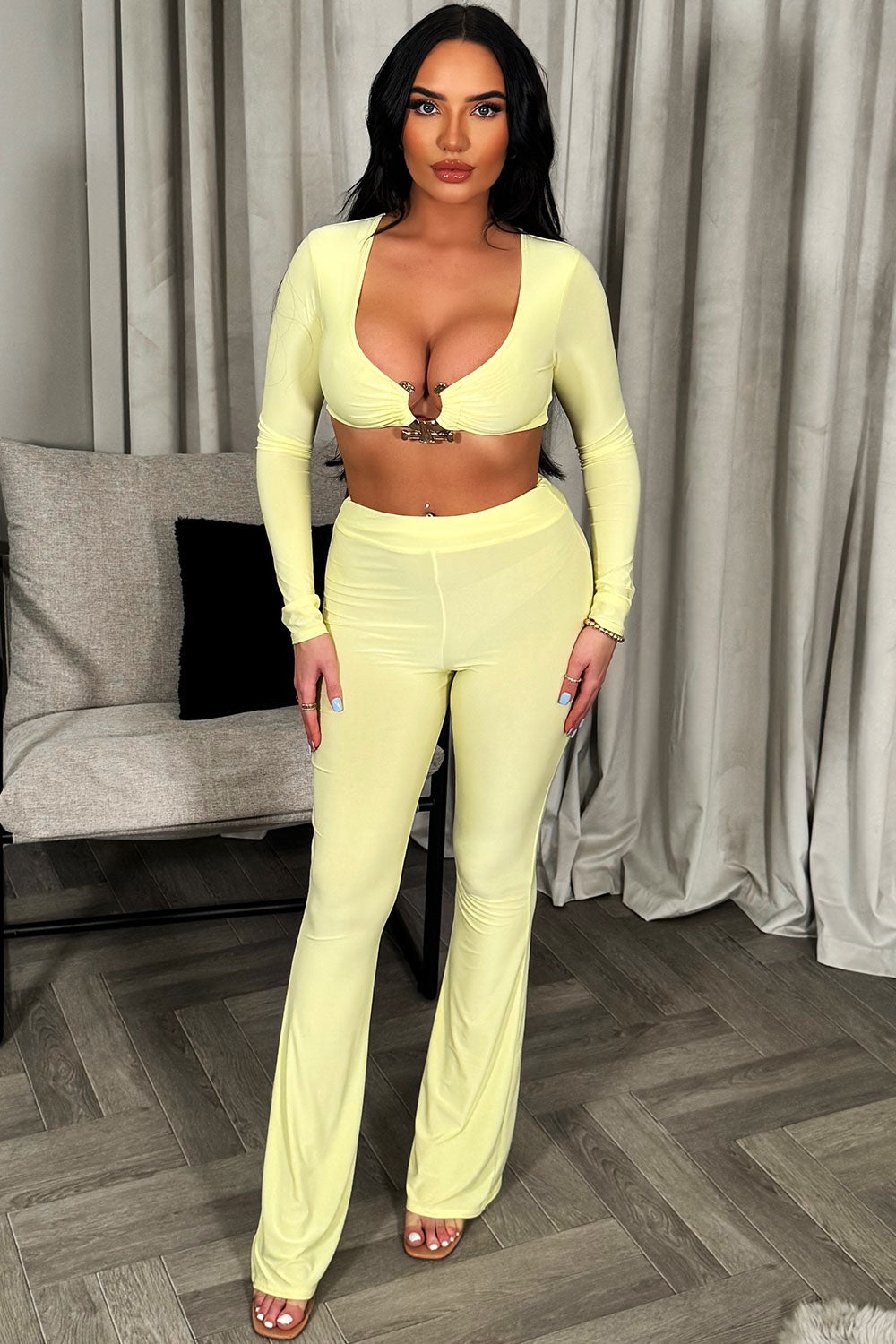 womens long sleeve crop top with gold buckle and skinny flare trousers two piece set