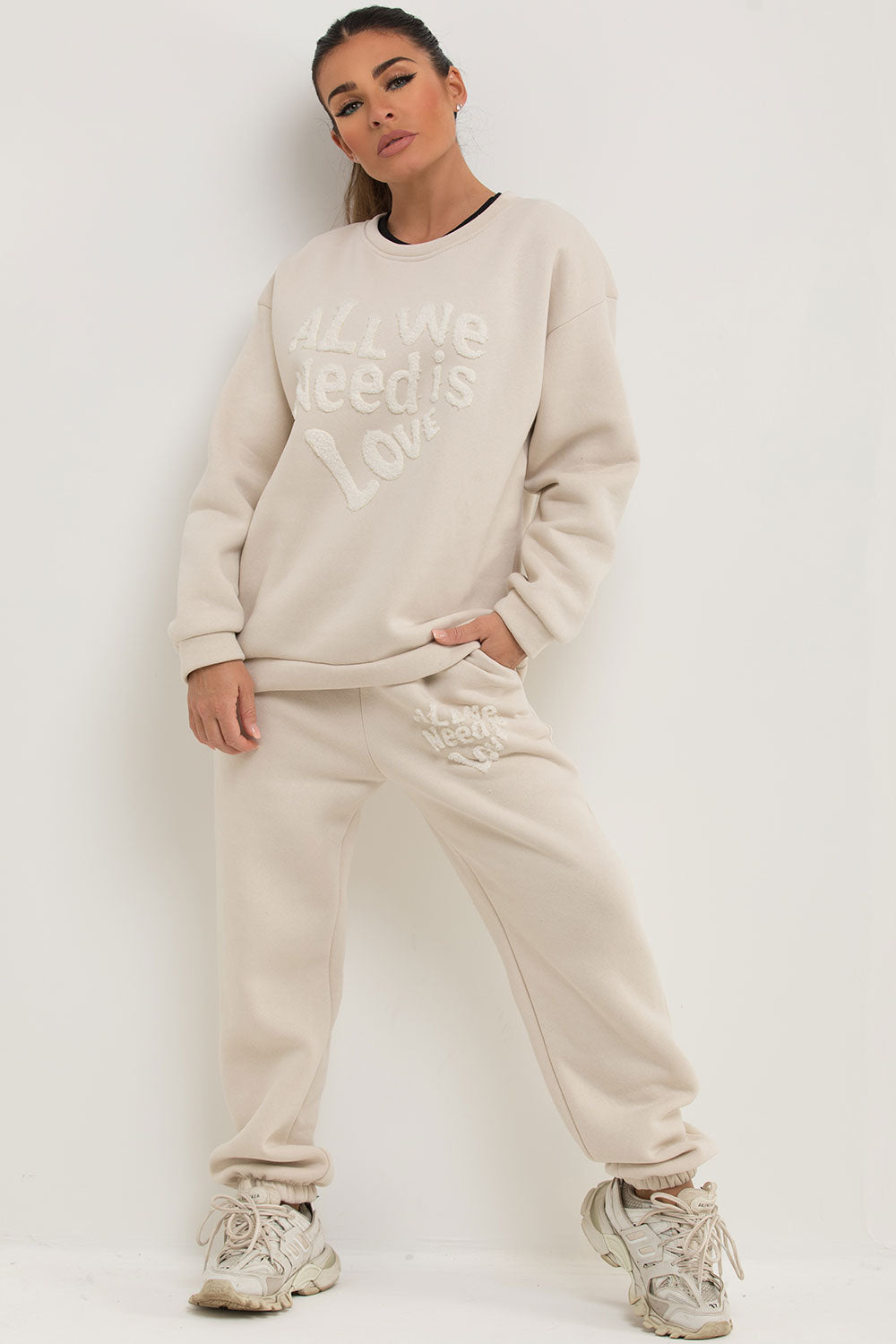 womens loungewear co ord set with all we need is love slogan