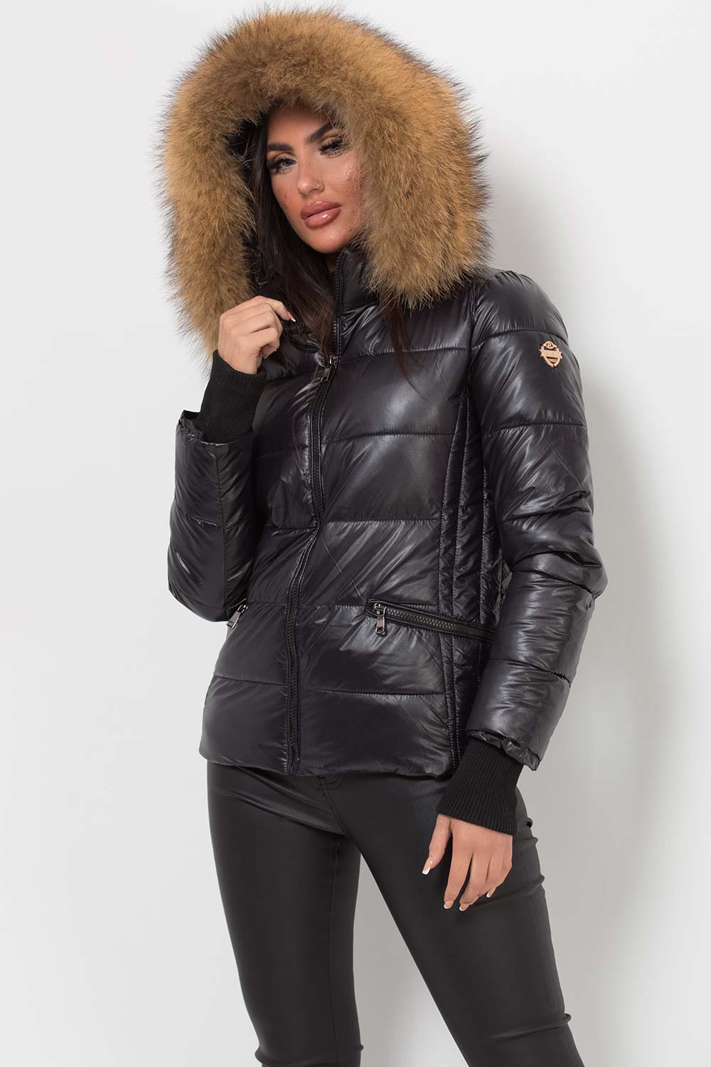 black puffer jacket with raccoon fur hood