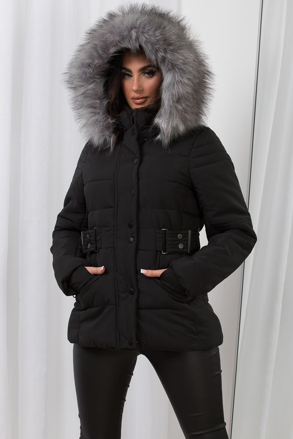 black puffer jacket with faux fur hood and belt