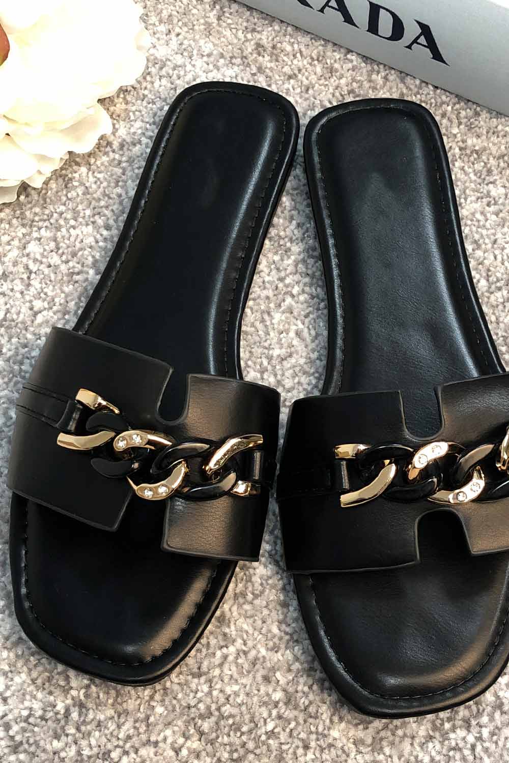 black slip on sliders with gold chain
