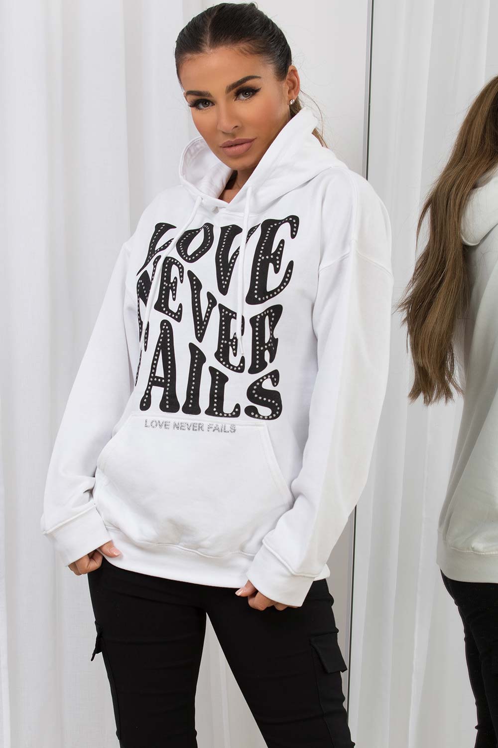 womens white hooded sweatshirt with love never fails slogan