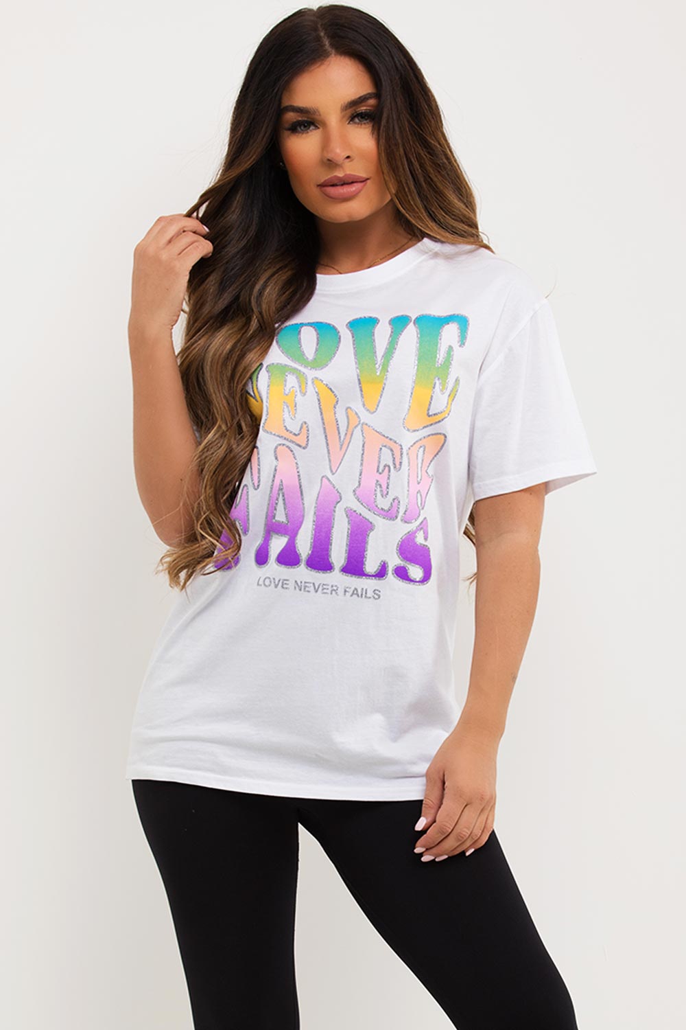 white oversized t shirt with love never fails slogan