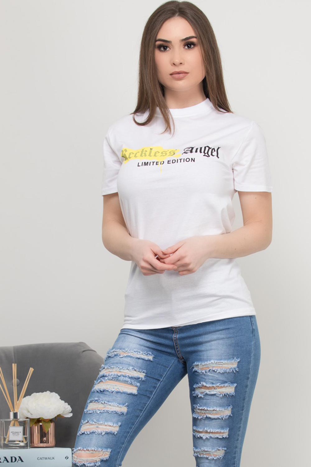 white oversized t shirt with reckless angel slogan