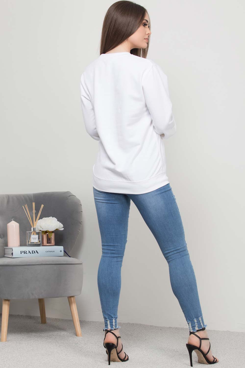 womens white sweatshirt with saint slogan