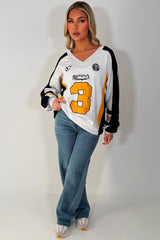 womens oversized sweatshirt athletic baseball jumper styled up 