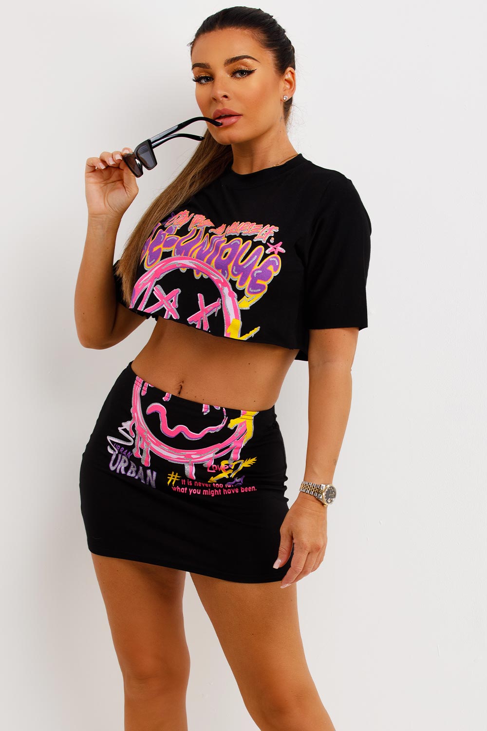 mini skirt and crop top with neon graphic print