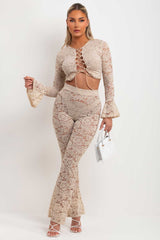 lace flare trousers and long flare sleeve lace up front crop top going out summer holiday festival outfit