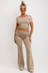 beige ruched side fold over flare trousers and crop top co ord set 