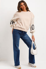 beige jumper with knitted sleeves love slogan styledup