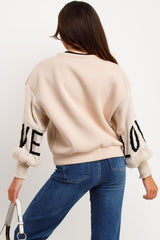 womens knitted sleeve jumper with love slogan