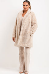 belted fur coat with collar and button fastening