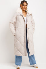 womens long quilted puffer coat with fur collar styled up