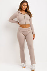 womens zip up crop hoodie and fold over waist buckle detail skinny flare trousers co ord set airport outfit