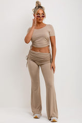 fold over flared trousers with ruched side and crop top co ord set two piece airport outfit