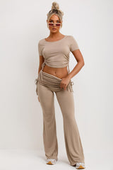 ruched side crop top and flare trousers with fold over detail  two piece outfit