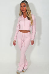 interlock sweatshirt and bell bottom top stitched trousers two piece loungewear set 