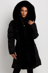 womens long padded puffer coat with faux fur trim and hood
