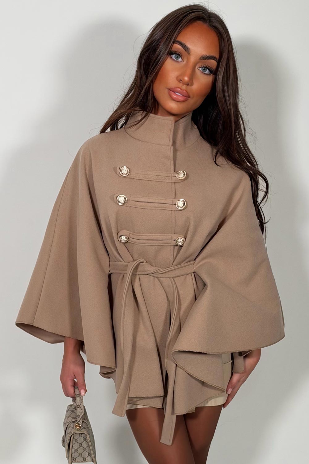 taupe cape with belt and button fastening christmas day outfit