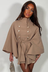 taupe cape with belt and button fastening christmas day outfit