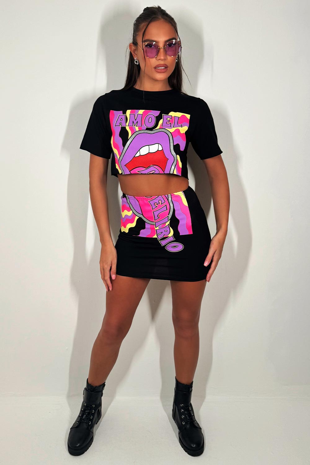 black crop top and skirt co ord with neon lips graphic print summer festival rave outfit