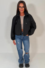 womens black toggle detail funnel neck jacket with cinched waist cernucci uk