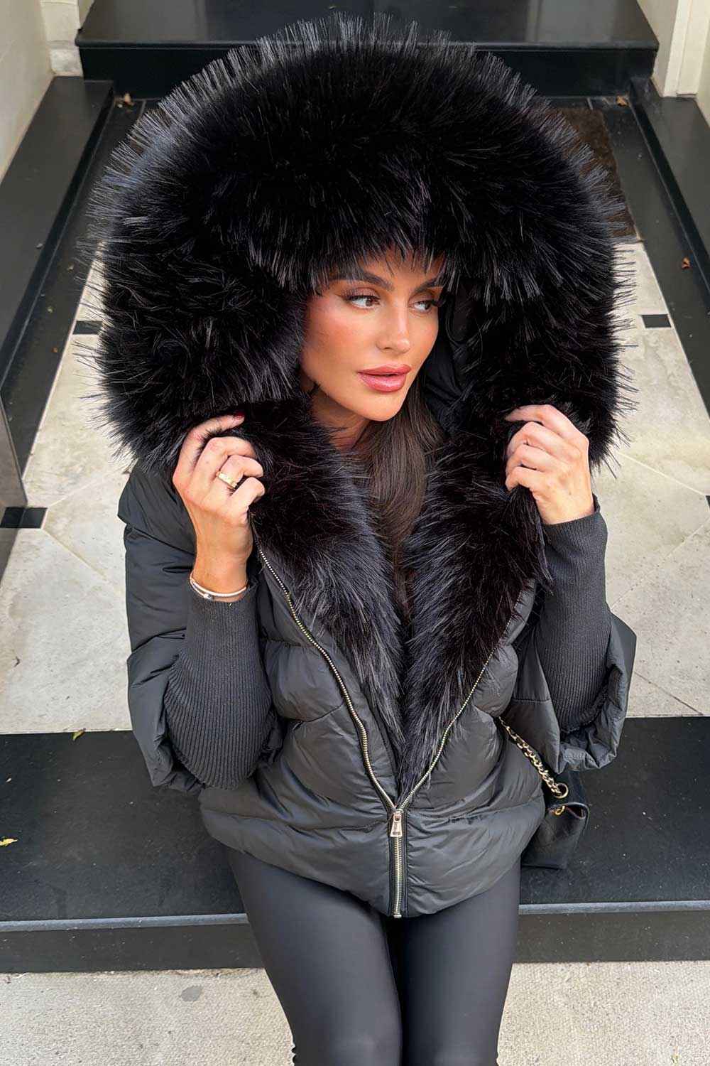 womens black puffer jacket with faux fur hood and trim for winter weathr resistant really warm and cosy styledup uk