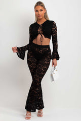 lace flare trousers and long flare sleeve lace up front crop top going out summer holiday festival outfit 