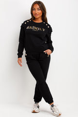 frill shoulder gold button top and trousers tracksuit set airport outfit