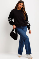 black jumper with knitted sleeves love slogan styledup