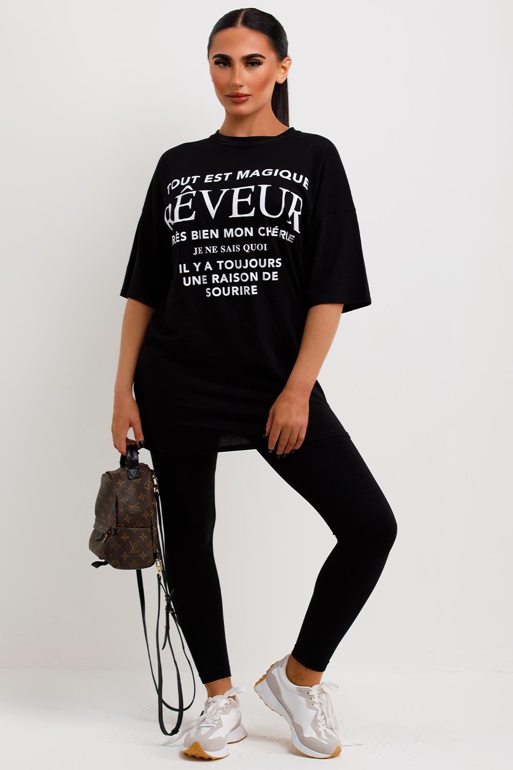 womens black t shirt with reveur slogan