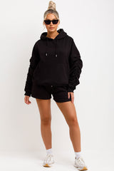 womens oversized ruched sleeve hoodie and shorts lounge set airport outfit