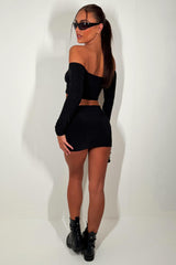 black short skirt and long sleeve ruched front off shoulder crop top summer holiday festival rave outfit