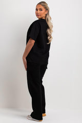womens black oversized t shirt and wide leg trousers with cargo pockets lounge set