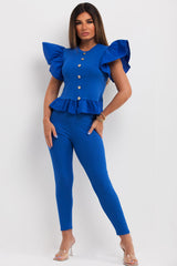 co ord with gold buttons ruffle frill sleeve and peplum hem