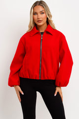 womens red puffed bomber jacket with front double welt pockets zara womens uk 